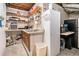 Handy kitchenette in a basement with a sink, shelving, refrigerator and plenty of storage at 3341 Camelot Way, Loganville, GA 30052