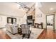 Comfortable living room featuring a stone fireplace and neutral decor at 3341 Camelot Way, Loganville, GA 30052