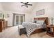 Cozy main bedroom with a ceiling fan, a decorative sign and access to the outside at 3341 Camelot Way, Loganville, GA 30052