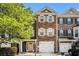Charming townhome with stone facade, shutters, and a well-maintained front yard at 3956 Church View Ln, Suwanee, GA 30024