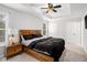 Spacious main bedroom with a tray ceiling, a large bed, and soft carpet floors at 3956 Church View Ln, Suwanee, GA 30024