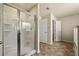 Bathroom featuring tiled floors, a large glass shower, and neutral paint at 11973 Lovejoy Crossing Way, Hampton, GA 30228