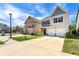 Suburban home exterior with a two-car garage, driveway, and neat front lawn at 11973 Lovejoy Crossing Way, Hampton, GA 30228