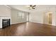A bright living room with fireplace and hardwood flooring leads to an outside patio at 11973 Lovejoy Crossing Way, Hampton, GA 30228