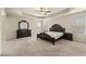 Main bedroom boasts tray ceiling, ceiling fan, and plenty of natural light from two windows at 11973 Lovejoy Crossing Way, Hampton, GA 30228