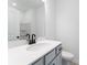 Stylish bathroom featuring a sleek vanity with modern fixtures and a well-lit mirror at 3726 Willingham Sw Run, Marietta, GA 30008