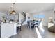 Bright, open kitchen with an island and seating flowing into a dining area with natural light at 3726 Willingham Sw Run, Marietta, GA 30008