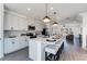 Open kitchen featuring an island with bar seating, modern appliances, and plenty of cabinet space at 3726 Willingham Sw Run, Marietta, GA 30008