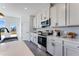 Well-equipped kitchen with modern appliances, quartz countertops, and stylish cabinetry at 3726 Willingham Sw Run, Marietta, GA 30008