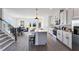 Open concept kitchen features an island, stainless appliances, and an adjacent dining area at 3726 Willingham Sw Run, Marietta, GA 30008