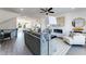 Open-concept living room featuring a modern fireplace, stylish decor, and seamless flow to the kitchen area at 3726 Willingham Sw Run, Marietta, GA 30008