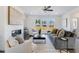 Comfortable living room with fireplace, stylish furniture, and plenty of natural light at 3726 Willingham Sw Run, Marietta, GA 30008