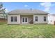 This home includes a spacious backyard with a covered patio, perfect for relaxation and outdoor activities at 3804 Hawk Tail Dr, Loganville, GA 30052