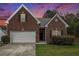 Charming one-story brick home featuring an attached garage and well-manicured front lawn at 3804 Hawk Tail Dr, Loganville, GA 30052