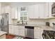 Bright kitchen featuring stainless steel appliances and ample counter space at 3804 Hawk Tail Dr, Loganville, GA 30052