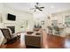 Spacious living room with hardwood floors, fireplace, and open concept layout at 3804 Hawk Tail Dr, Loganville, GA 30052