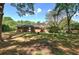Mature trees and a well-manicured lawn surround the home's exterior, creating a peaceful and private setting at 4361 Stanley Dr, Powder Springs, GA 30127