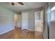 Bedroom featuring hardwood floors, closet, an ensuite bathroom and adjacent hallway and bedroom doors at 4361 Stanley Dr, Powder Springs, GA 30127