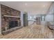 Modern kitchen with stainless steel appliances and a brick fireplace in the adjoining living space at 4361 Stanley Dr, Powder Springs, GA 30127