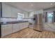 Bright kitchen featuring stainless steel appliances, updated cabinets, and a mosaic backsplash at 4361 Stanley Dr, Powder Springs, GA 30127