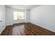 Bright bedroom with wood floors, white walls and trim, a window and a closet at 742 Hope Hollow Ln, Loganville, GA 30052