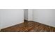 Neutral bedroom featuring wood floors, white walls, and trim at 742 Hope Hollow Ln, Loganville, GA 30052