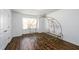 Bedroom showcasing a unique metal carriage bed frame, wood floors, a window and white walls at 742 Hope Hollow Ln, Loganville, GA 30052
