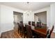 Dining room featuring a dark wood table with chairs and views into the living room and foyer at 742 Hope Hollow Ln, Loganville, GA 30052