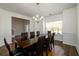 Dining Room featuring a dark wood table with chairs and a chandelier at 742 Hope Hollow Ln, Loganville, GA 30052