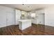 Bright kitchen featuring white cabinets, an island, stainless appliances, and modern pendant lighting at 742 Hope Hollow Ln, Loganville, GA 30052