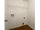 Laundry room with overhead wire rack and hook at 742 Hope Hollow Ln, Loganville, GA 30052