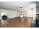 Bright open-concept living room featuring a ceiling fan, an open plan, and wood-style floors at 742 Hope Hollow Ln, Loganville, GA 30052