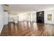 A spacious living room adjacent to the kitchen, with a fireplace and many windows for natural light at 742 Hope Hollow Ln, Loganville, GA 30052