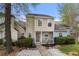 Charming two-story home featuring a cozy front porch, landscaped yard, and neutral siding at 5908 Trent Walk Dr, Lithonia, GA 30038