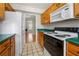 The kitchen offers matching appliances and laminate countertops at 5908 Trent Walk Dr, Lithonia, GA 30038