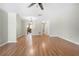 Spacious living room showcases hardwood floors and leads to the kitchen at 5908 Trent Walk Dr, Lithonia, GA 30038