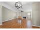 Spacious living room with hardwood floors, fireplace, ceiling fan and double french doors at 5908 Trent Walk Dr, Lithonia, GA 30038