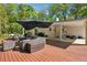 Spacious back deck with comfortable outdoor seating and an umbrella, perfect for entertaining or relaxing at 1155 Christian Se Cir, Conyers, GA 30013