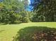 Lush green backyard with towering trees offers shade and privacy, perfect for outdoor activities and relaxation at 1155 Christian Se Cir, Conyers, GA 30013