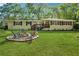 Beautiful backyard with brick firepit and a well-maintained lawn perfect for outdoor gatherings at 1155 Christian Se Cir, Conyers, GA 30013