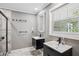 Modern bathroom with double vanity, walk-in shower, and elegant fixtures at 1155 Christian Se Cir, Conyers, GA 30013