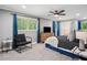 Cozy bedroom with a ceiling fan, natural light, and ample closet space at 1155 Christian Se Cir, Conyers, GA 30013