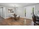 Bright dining area with modern light fixture, open to the kitchen and flooded with natural light at 1155 Christian Se Cir, Conyers, GA 30013