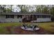 Charming home exterior with a cozy fire pit area and comfortable seating, perfect for enjoying outdoor gatherings at 1155 Christian Se Cir, Conyers, GA 30013
