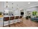 Open-concept kitchen with breakfast bar seamlessly flows into the living and dining area at 1155 Christian Se Cir, Conyers, GA 30013