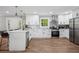 Modern kitchen with white cabinets, stainless steel appliances, and a functional island with seating at 1155 Christian Se Cir, Conyers, GA 30013