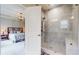 Bathroom featuring a tiled walk-in shower with a glass door and a view to the bedroom at 2168 Rock Creek Park, Decatur, GA 30033