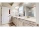 This bathroom features a double vanity with light countertops, lots of storage, and a walk-in shower at 2168 Rock Creek Park, Decatur, GA 30033