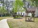 Community amenities including a covered swing, walking paths, and landscaping for community enjoyment at 2168 Rock Creek Park, Decatur, GA 30033