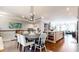 Bright dining room featuring a modern chandelier and an open floor plan with hardwood floors and neutral decor at 2168 Rock Creek Park, Decatur, GA 30033